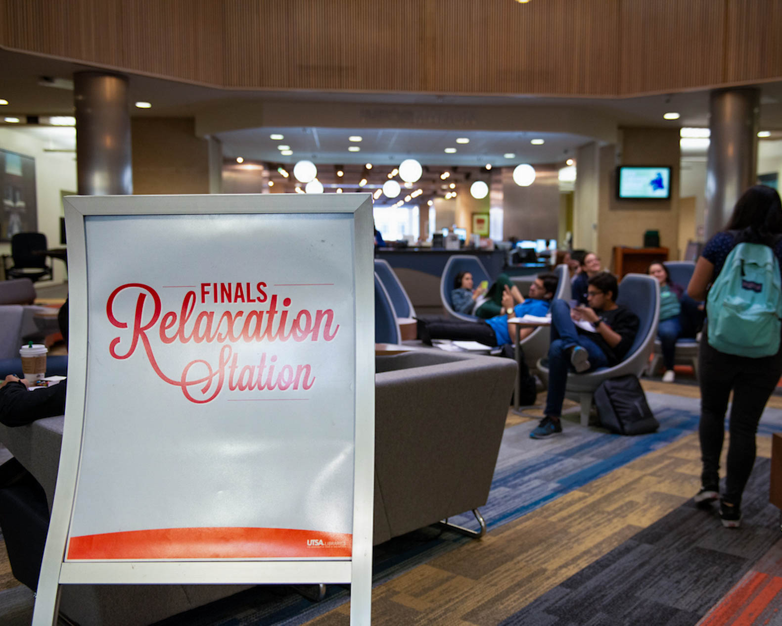 Unwind Before the Grind event with sign that says relaxation station